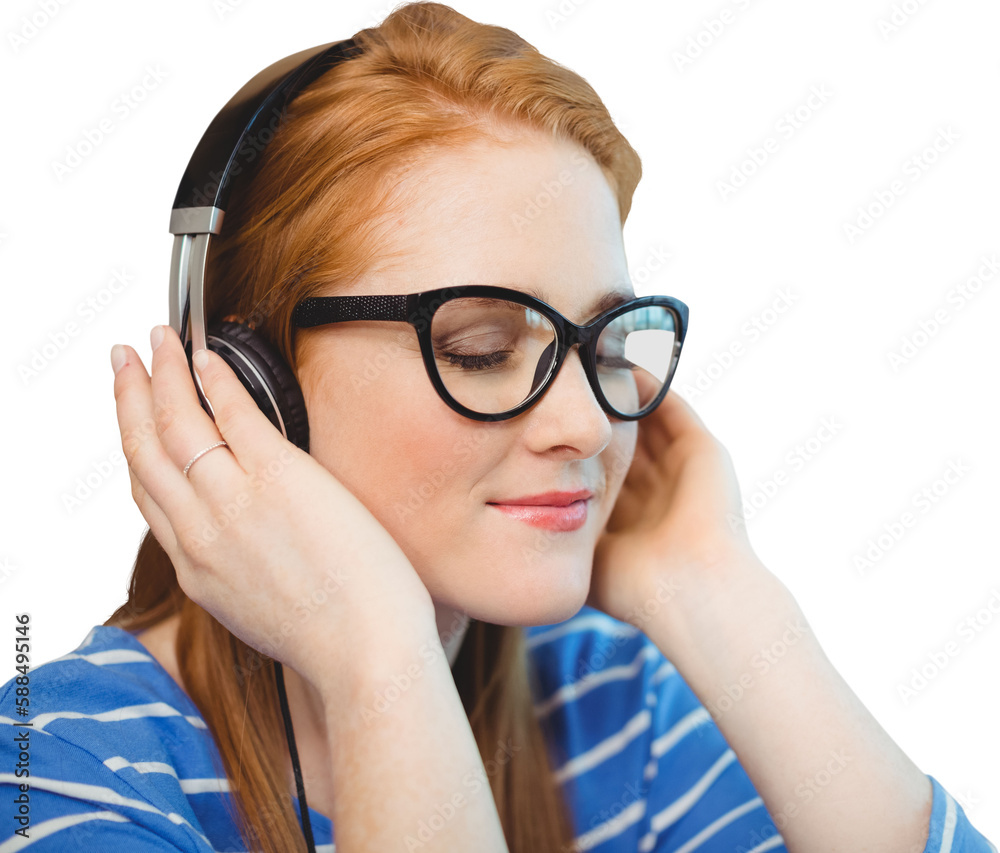 Beautiful redhead woman enjoying music from headphones Beautiful redhead woman enjoying music from headphones