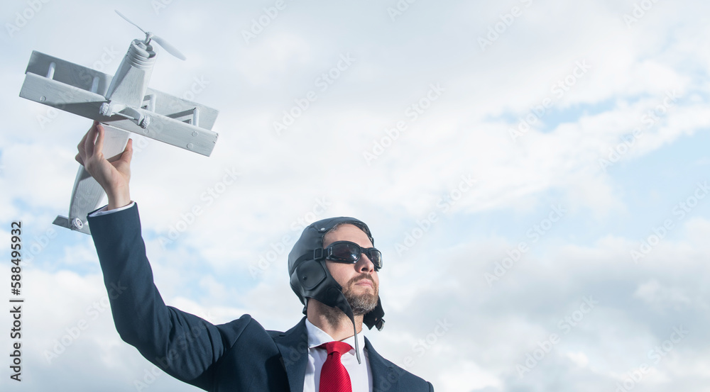 businessman in suit and pilot hat launch plane toy. leadership businessman in suit and pilot hat launch plane toy. leadership