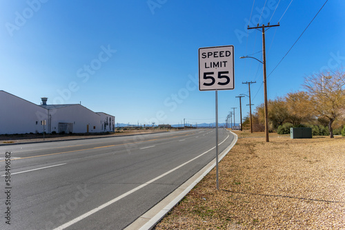 A 55 Speed Limit street sign on a empty