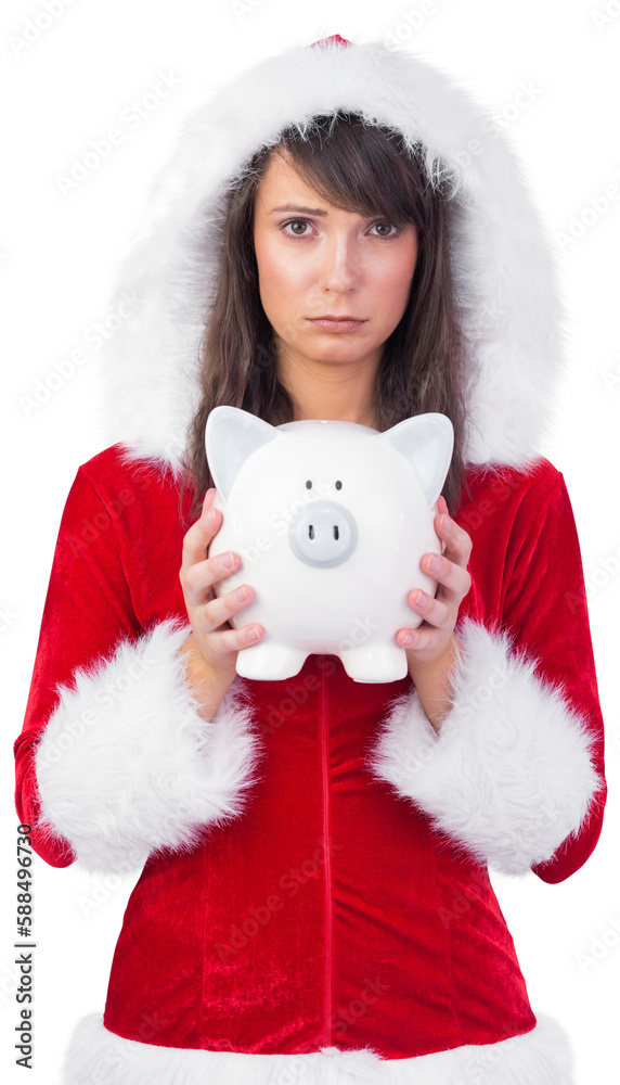 Obraz premium Sad festive woman holding a piggy bank in her hands