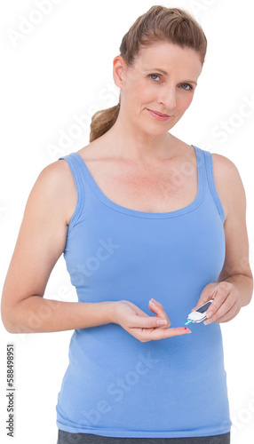 Woman using diabetes blood glucose moniter photo
