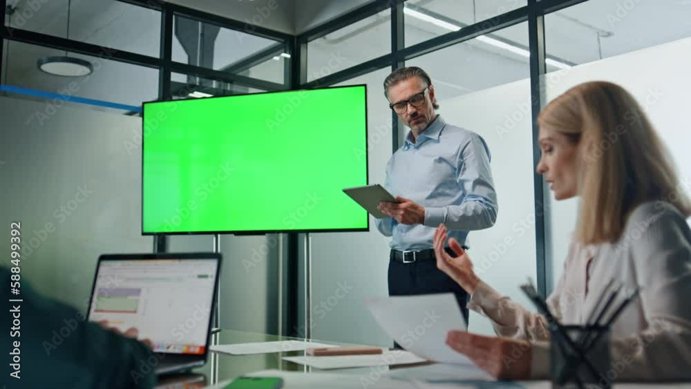 Businessman presenting green screen strategy indoors. Coach teaching managers