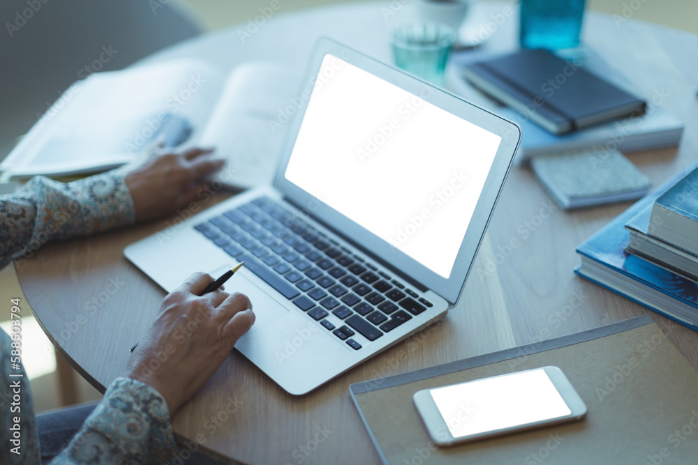 High angle view of businesswoman using laptop High angle view of businesswoman using laptop
