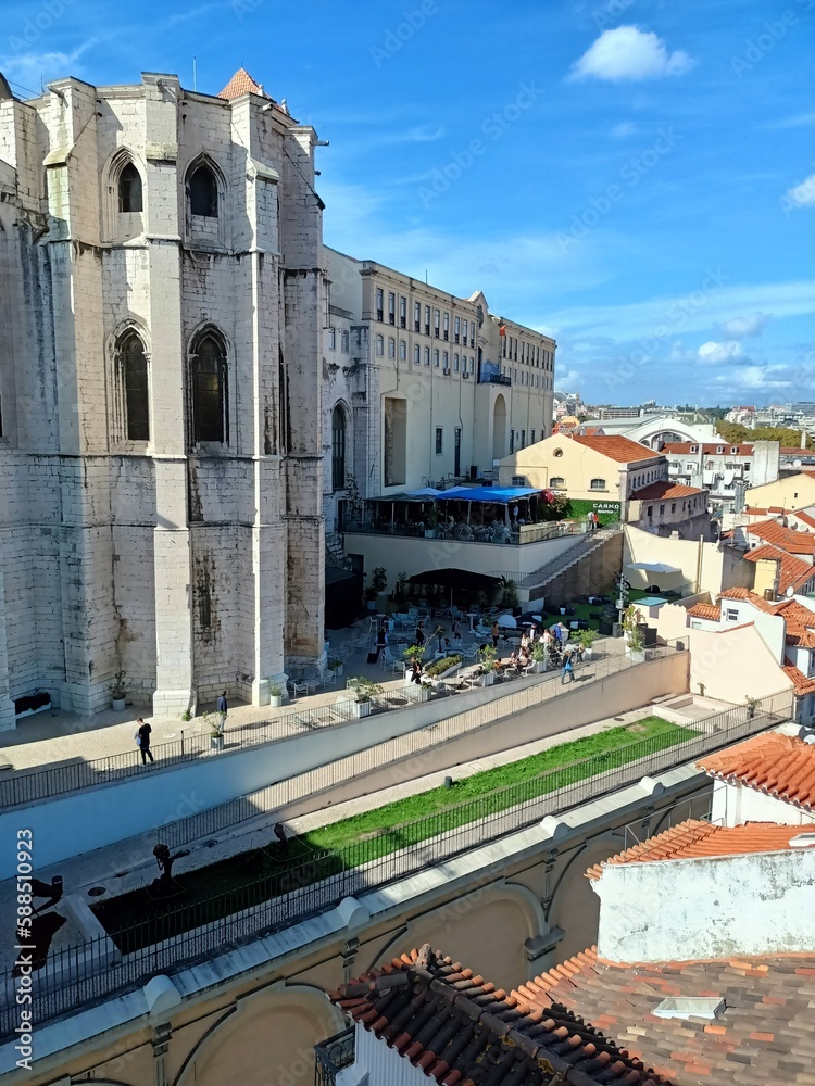 Top view of streets and houses in Lisbon with ceramic tiles and blue sky