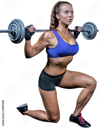 Fit woman exercising while lifting crossfit
