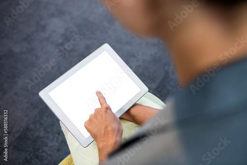 Woman pointing on digital tablet
