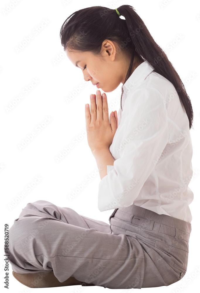 Businesswoman sitting in lotus pose Businesswoman sitting in lotus pose
