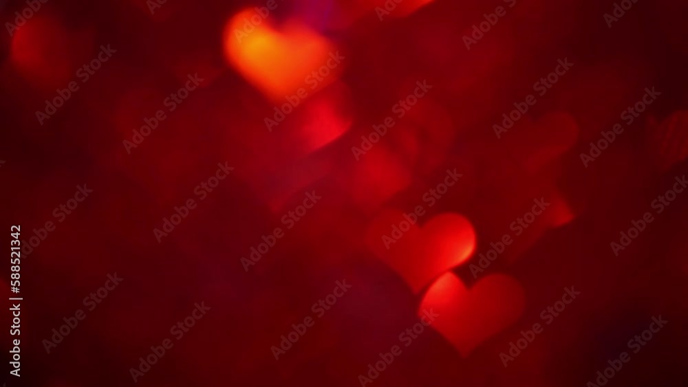 Elegant and Enchanting Red Heart-Shaped Bokeh in Slow Motion. Elegant and Enchanting Red Heart-Shaped Bokeh in Slow Motion.