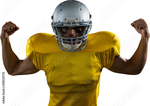 Portrait of American football player flexing muscles
