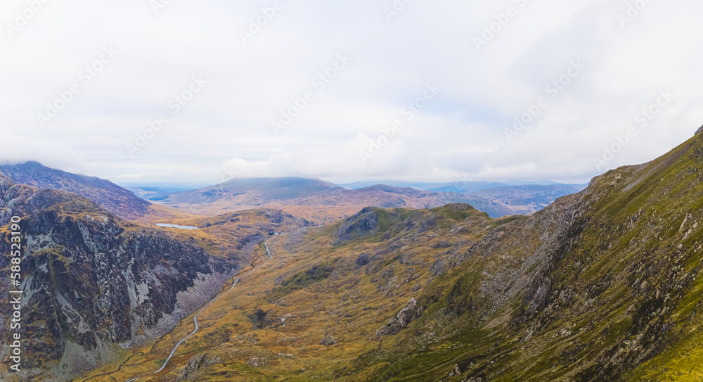 aerial shot of mountains of Snowdonia in Wales, mountainous region in northwestern Wales and a national park in area, UK. High quality photo aerial shot of mountains of Snowdonia in Wales, mountainous region in northwestern Wales and a national park in area, UK. High quality photo