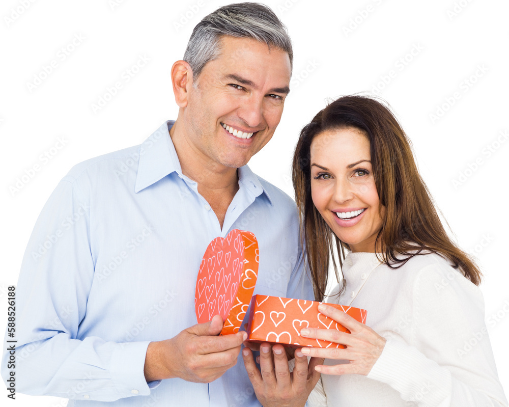 Portrait of happy couple opening present