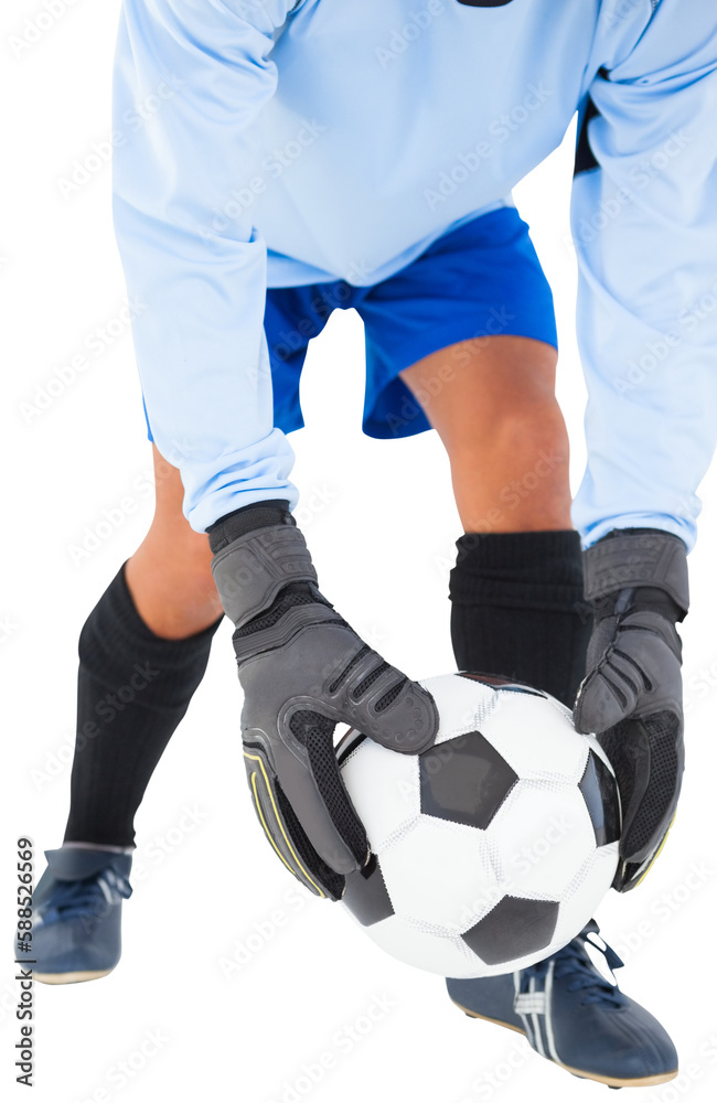 Goalkeeper bending and holding football