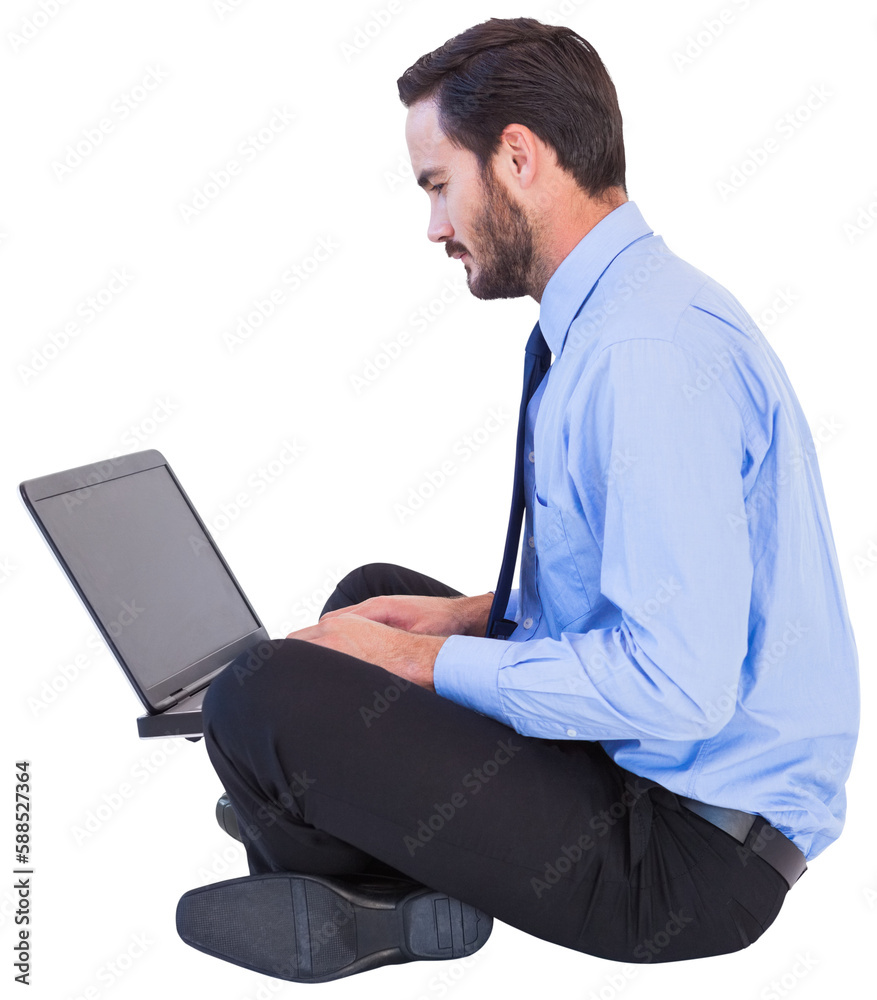 Businessman sitting on the floor using his laptop Businessman sitting on the floor using his laptop
