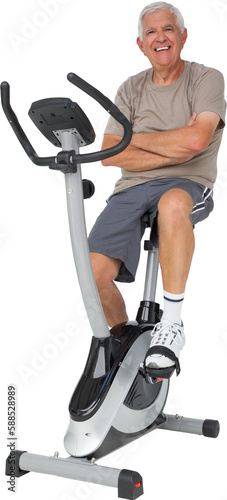 Full length portrait of a senior man on stationary bike
