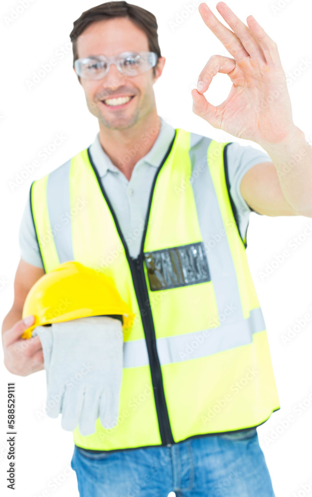 Carpenter holding gloves and hardhat while gesturing OK Carpenter holding gloves and hardhat while gesturing OK