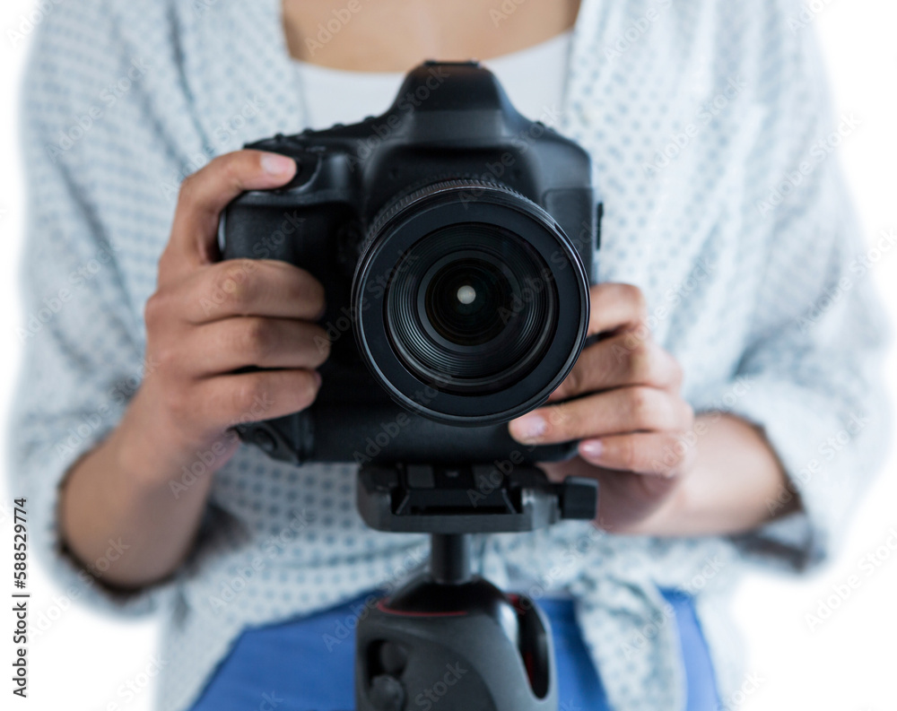 Mid section of woman holding digital camera 