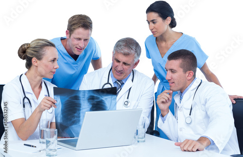 Team of doctors examining chest X-ray