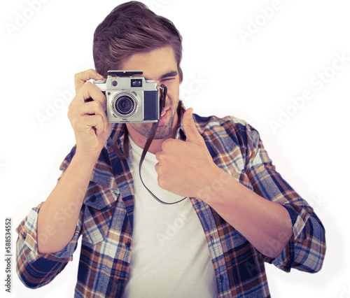 Hipster showing thumbs up while photographing