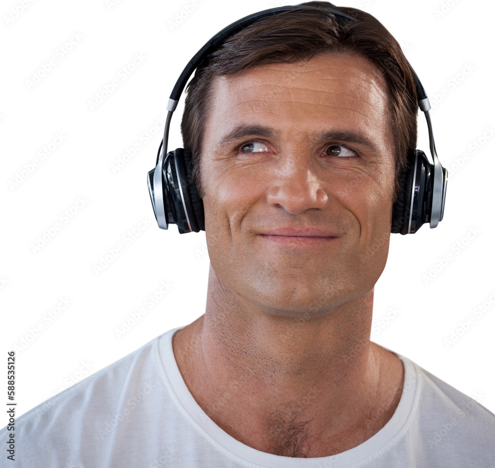 Smiling mature man wearing headphones looking away Smiling mature man wearing headphones looking away