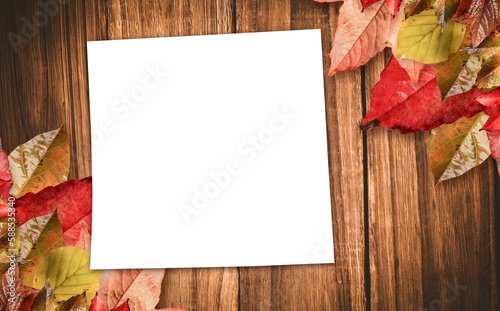 Blank page on table with autumn leaves