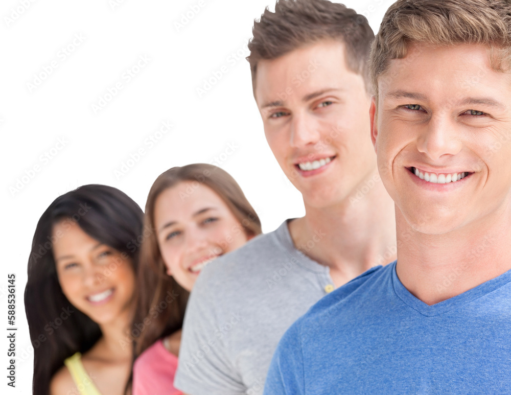 Four smiling people standing in front of one another at a slight angle Four smiling people standing in front of one another at a slight angle