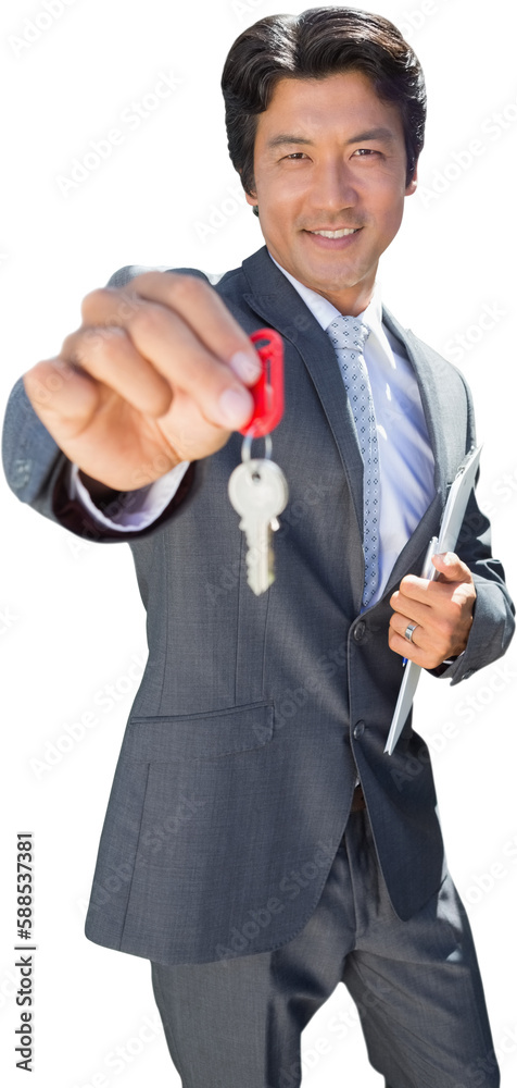 Fototapeta premium Confident estate agent standing at front door showing key