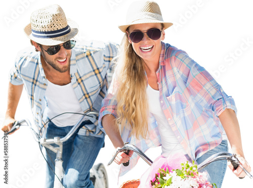 Happy young couple cycling