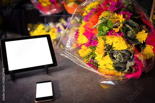 Technology with fresh colorful bouquet