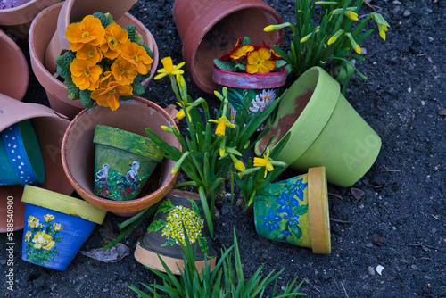 colorful pots painted in spring patterns with daffodils
