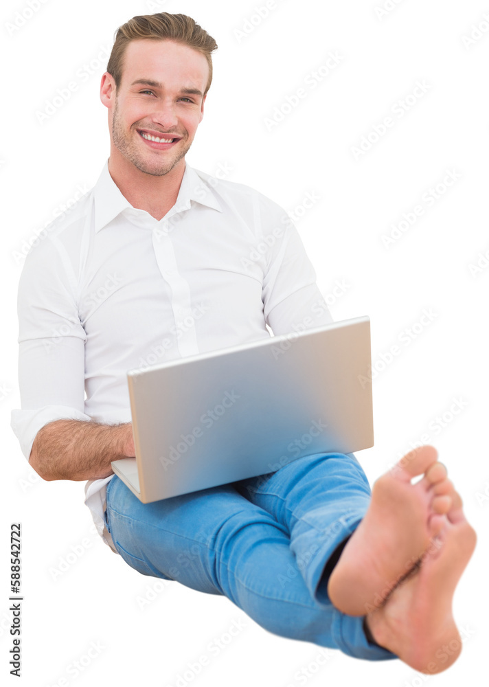 Portrait of man using laptop with legs crossed at ankle Portrait of man using laptop with legs crossed at ankle