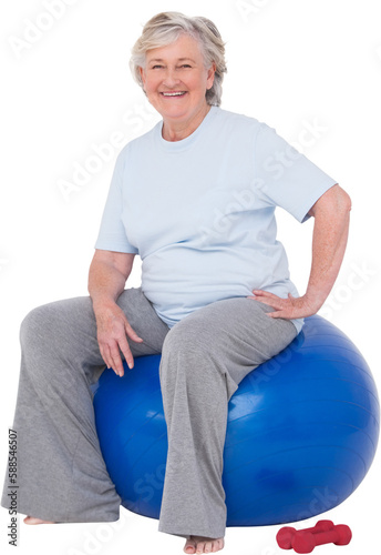 Senior woman sitting on exercise ball