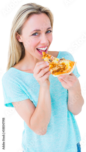 Cheerful blonde eating slice of pizza