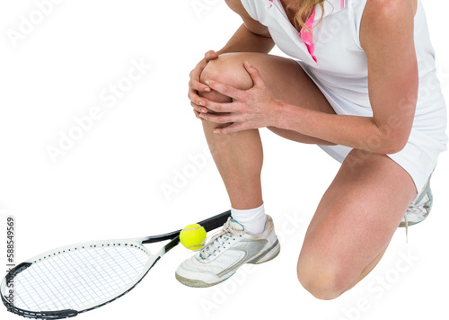 Injured athlete with tennis racket and tennis ball