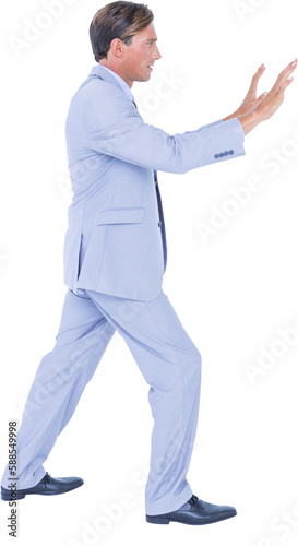 Businessman pushing on white background
