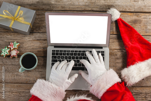 Santa Claus using laptop at home