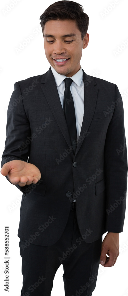 Smiling businessman looking at palm of hand Smiling businessman looking at palm of hand