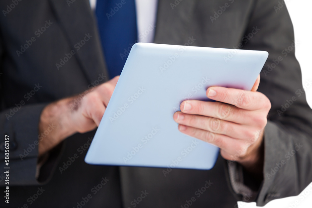 Businessman scrolling on his digital tablet Businessman scrolling on his digital tablet