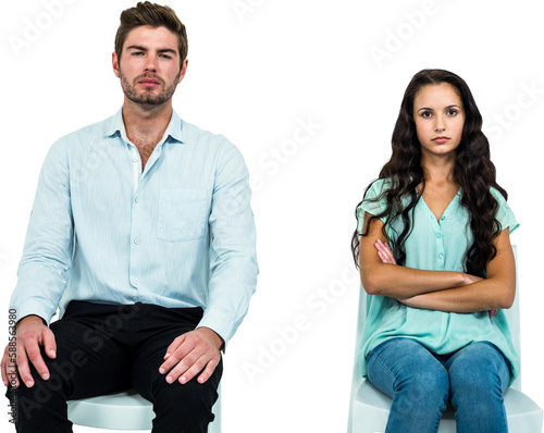 Couple sitting on chairs not talking after argument