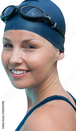 Portrait of smiling young woman wearing swimming cap