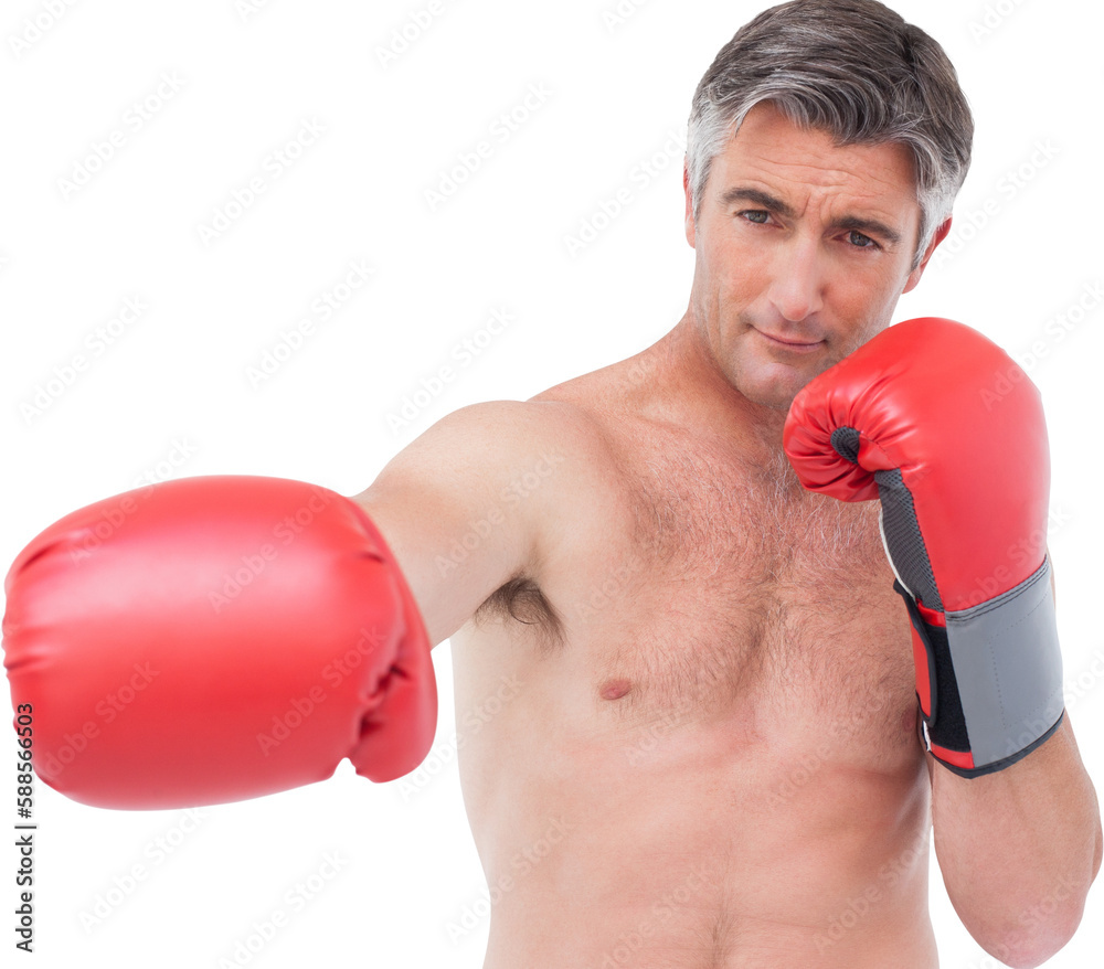 Fit man punching with boxing gloves Fit man punching with boxing gloves
