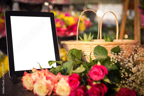 Digital tablet with fresh flowers