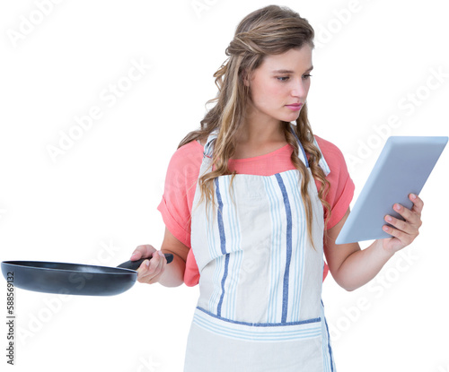 Happy hipster woman holding laptop and frying pan 