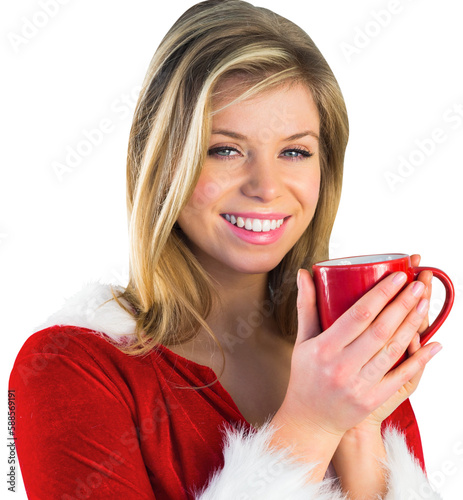 Pretty santa girl holding mug