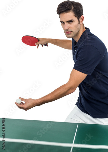 Confident male athlete playing table tennis