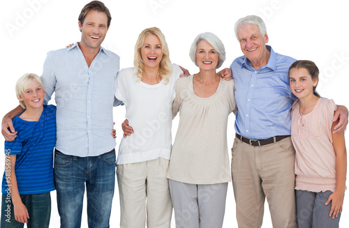 Multi-generation family standing against white background