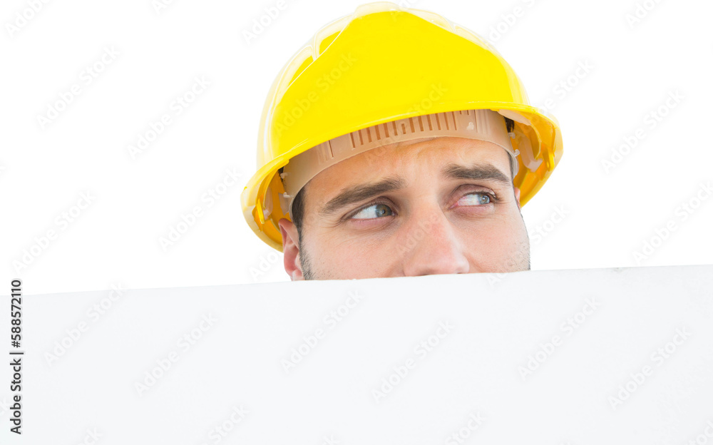 Repairman looking away while in front of billboard Repairman looking away while in front of billboard