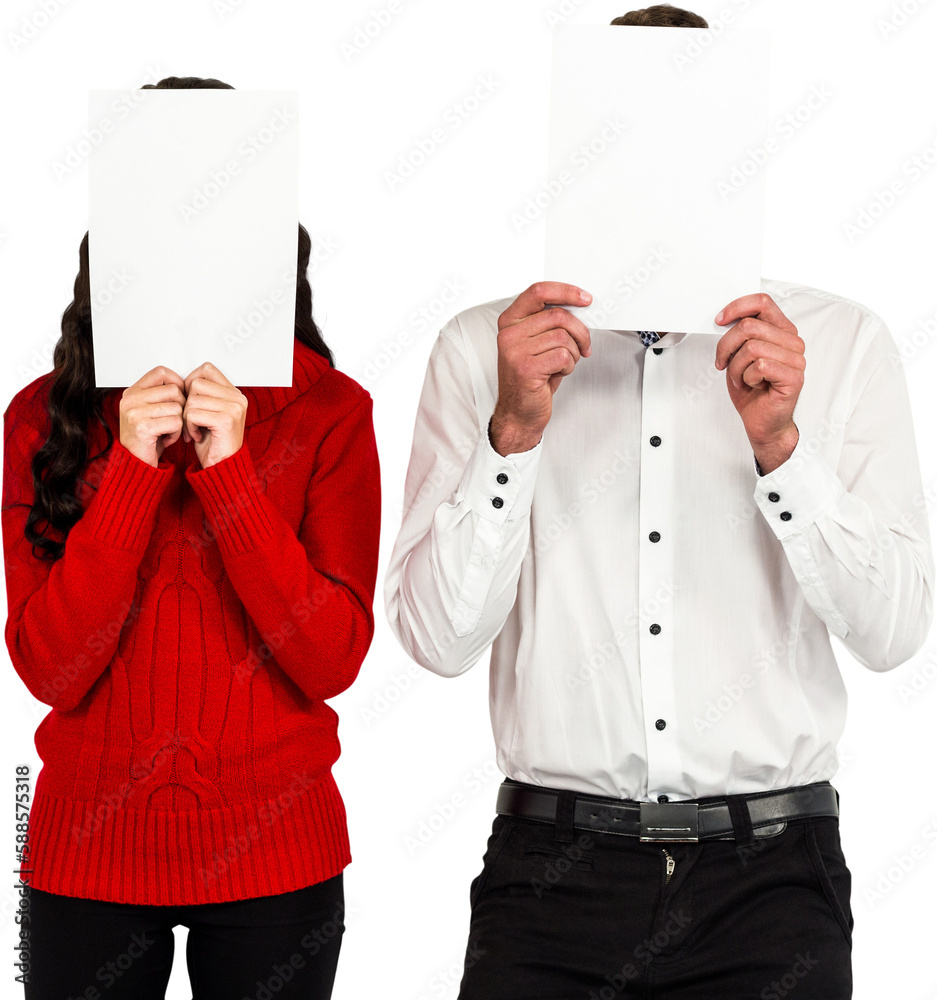 Fototapeta premium Couple hiding face with papers