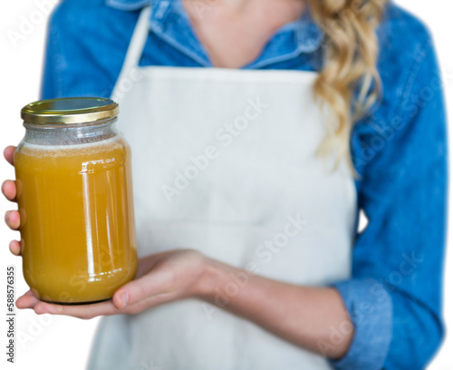 Midsection of woman holding jar