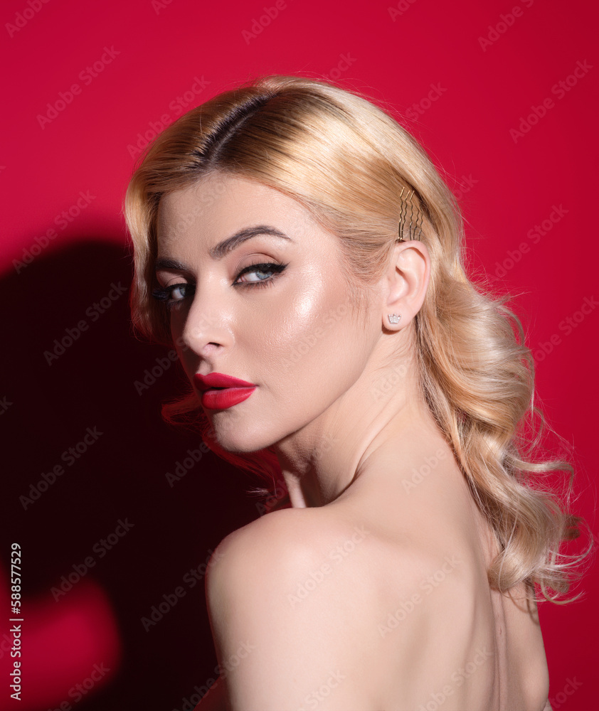 Fototapeta premium Beauty woman with fashion eyes make up, red lipstick on plump lips, blonde hair, close up face. Sensual woman with beautiful face and smooth skin, bare shoulder. Sexy model with natural makeup.