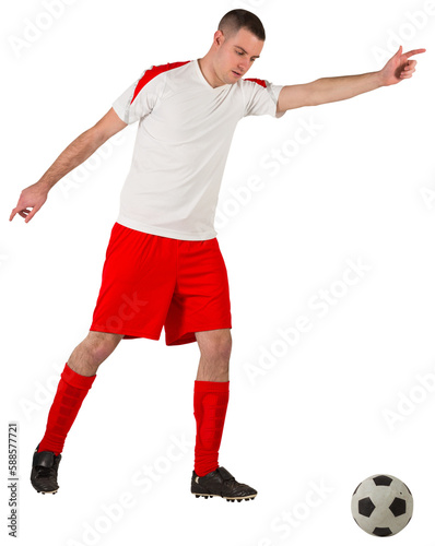 Fototapeta Naklejka Na Ścianę i Meble -  Fit football player playing with ball